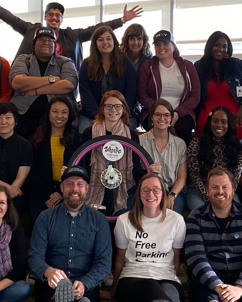 With the Lyft Bikes & Scooters team, holding a bike wheel